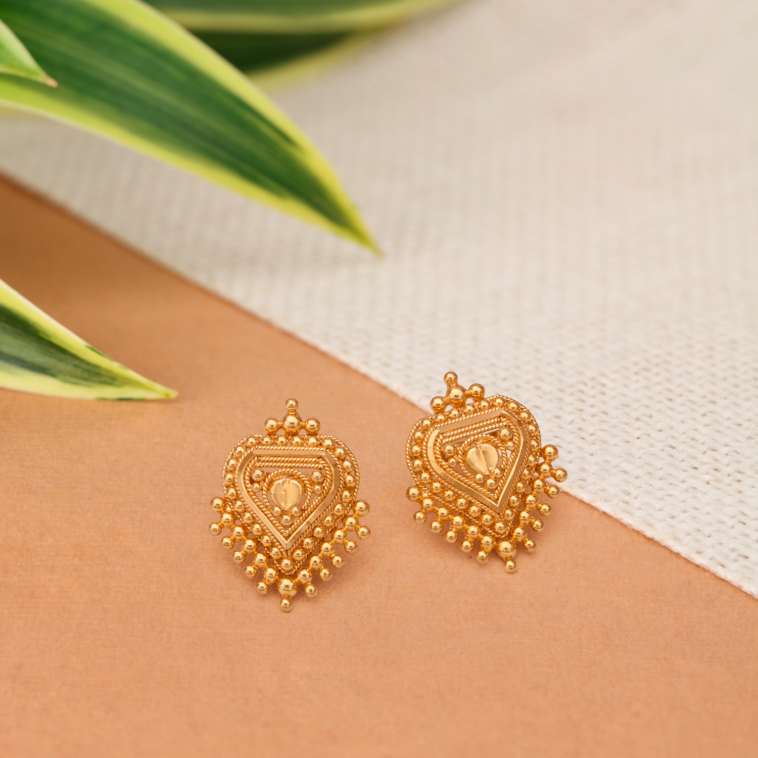 Tanishq gold ear studs with price discount